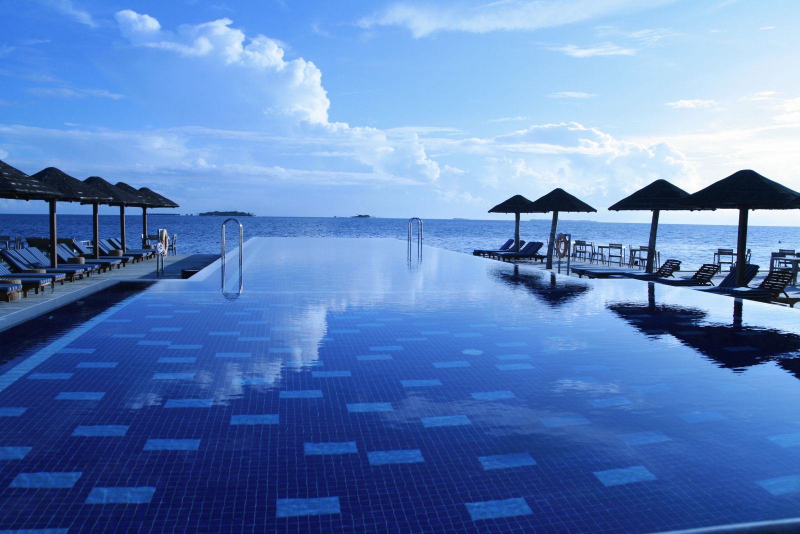 Inviting resort-style poolside lounge and patio