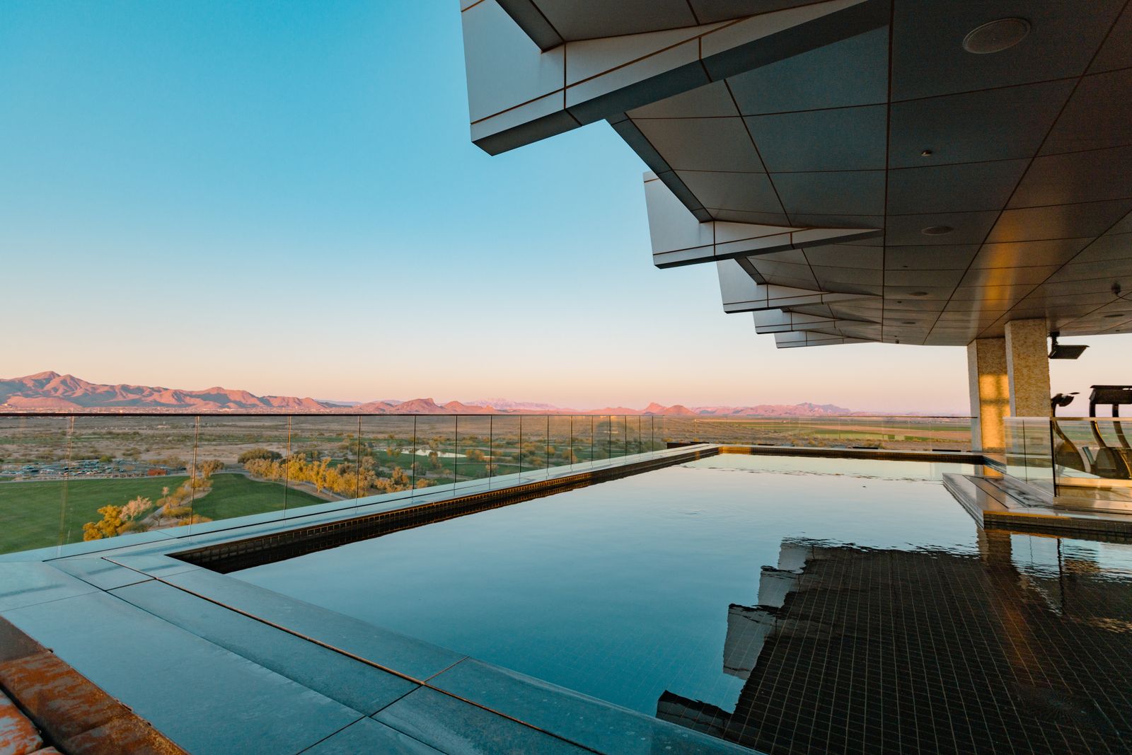 Infinity pool overlooking the Arizona desert and mountains at sunset